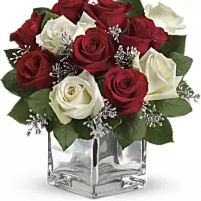 Give Christmas a charmingly contemporary spin with lush red and white roses in a dazzling mirrored silver cube. With a merrily moderate price tag, it makes the perfect gift for all the people on your list – naughty or nice.

The impressive bouquet includes red roses and white roses accented with assorted greenery.